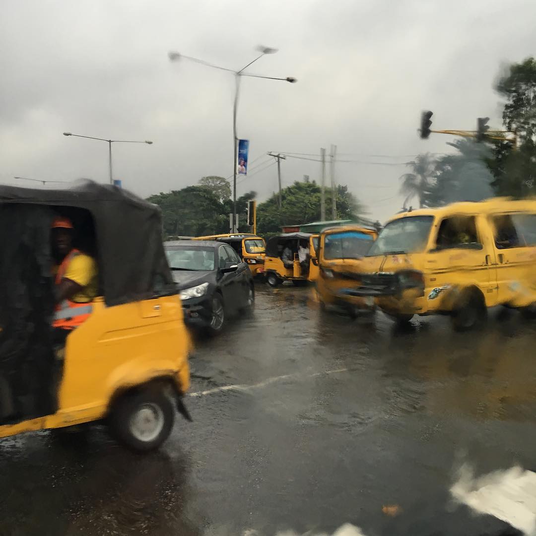 Danfo wading through water on a rainy Lagos day