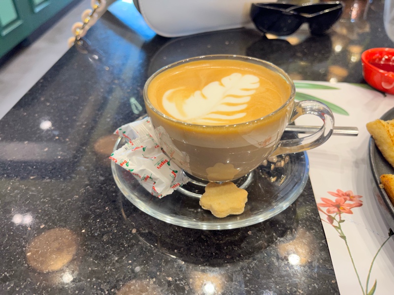 Coffee with leaf shaped milk swirl served at La Chaumiere